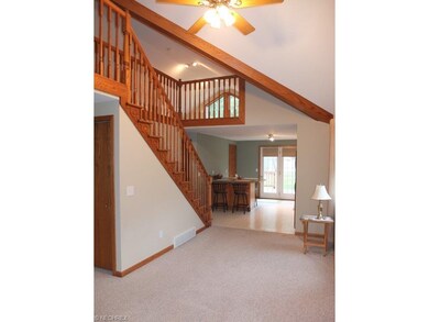 2 story living room is open to the kitchen.