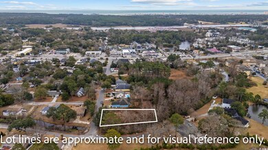 Drone / aerial view featuring a water view and a r