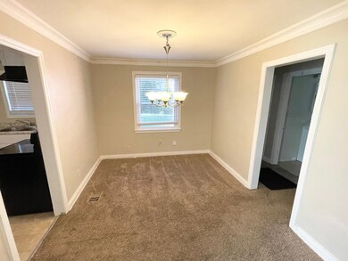 Unfurnished dining area with carpet floors, an inv