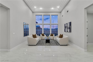 Living room featuring marble tiled flooring, baseb