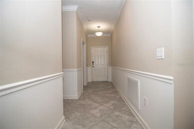 Foyer with chair rail, accent paint and crown mold