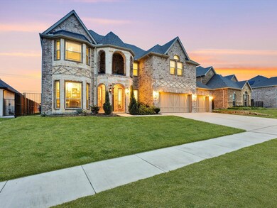 French country inspired facade with a lawn and a g