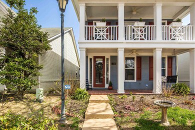 Property entrance featuring a balcony, covered por