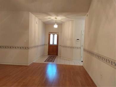 LOOKING INTO THE ENTRY FROM LIVING ROOM