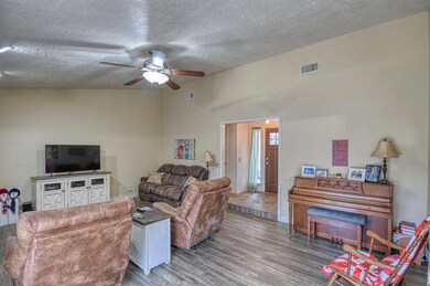 Living room featuring a textured ceiling, ceiling 
