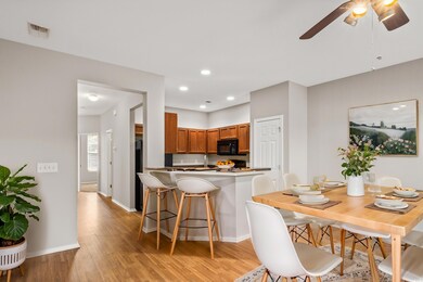 Kitchen featuring kitchen peninsula, ceiling fan, 