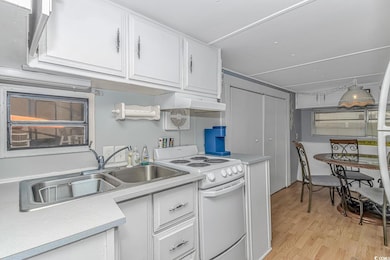 Kitchen featuring light hardwood / wood-style floo