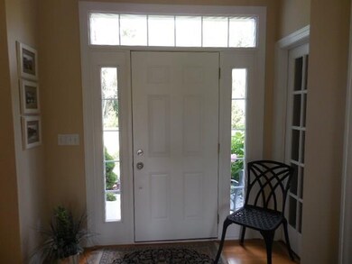 Entering from the landscaped front paver stone wal