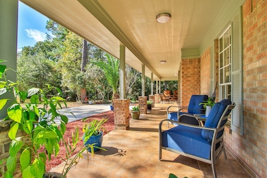 Relax on the front porch while taking in lush greenery.
