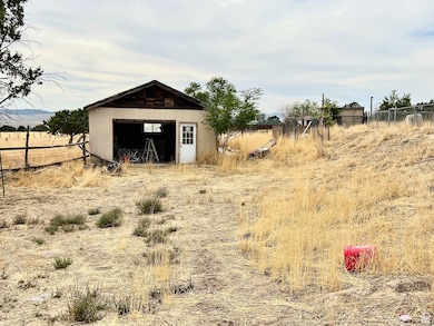 View of yard with an outbuilding