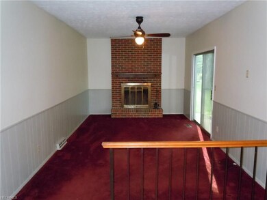 Freshly painted family room with wood burning fire