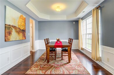 Grand Formal Dining Room with Octagon Trey Ceiling & seating for 10+.