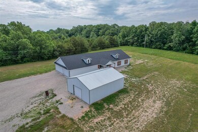 Shop is 20x30, electric and concrete flooring.