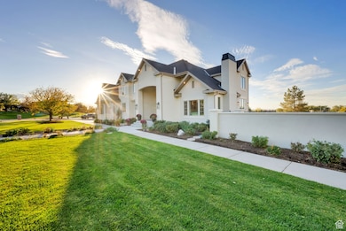 View of front of home with stucco siding and a chimney