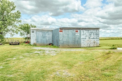 View of pole building with a view of countryside