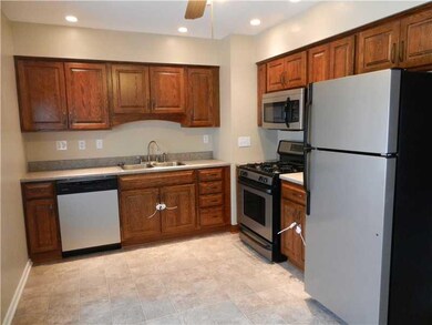 Kitchen. ANOTHER VIEW OF THE SPACIOUS KITCHEN WITH RECESSED LIGHTS AND CEILING FAN