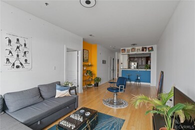Living room with hardwood / wood-style flooring