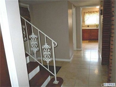 Formal Entry: Tile floor, Refinished Wood Stair-st