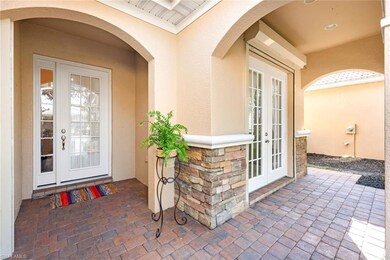 View of exterior entry with a patio area and frenc