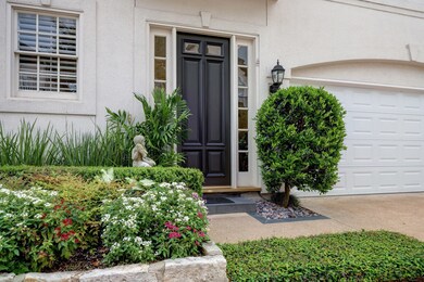 Beautiful front elevation with mature landscaping.