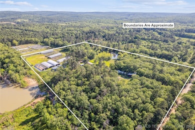 Aerial overview of property's location featuring a forest and property parcel outlined