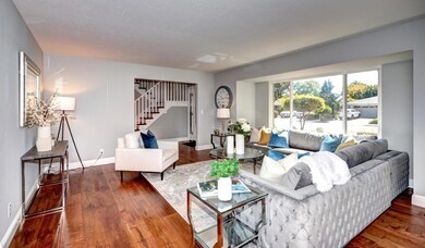 Spacious living room with bay window.