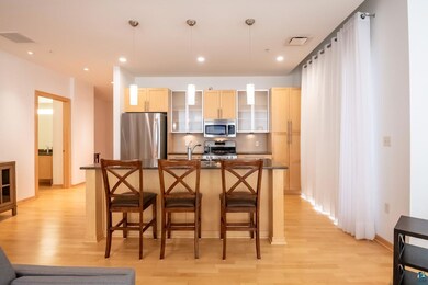 Kitchen featuring pendant lighting, light hardwood