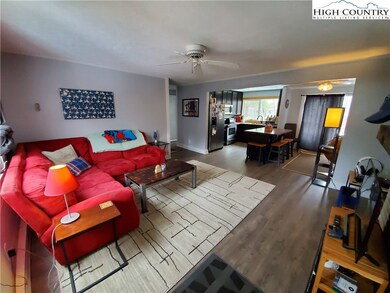 Living room into kitchen in unit 213.