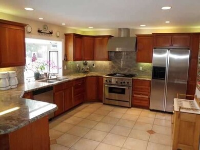 kitchen w/SS appliances, granite counters, tile fl