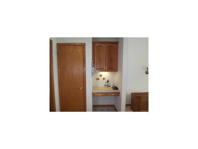 Kitchen. Kitchen area has a pantry behind this doo