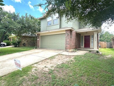 Traditional home featuring concrete driveway, an 