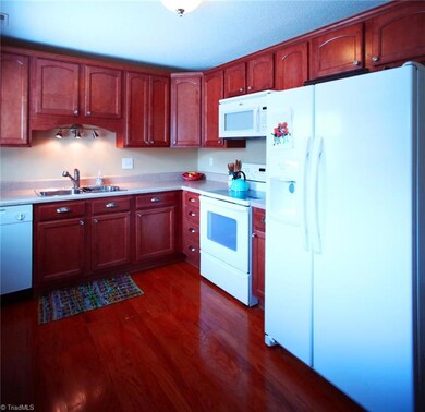 Plenty of cabinet space. Wood floors.