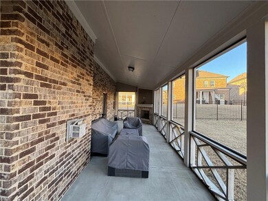Sunroom / solarium featuring lofted ceiling