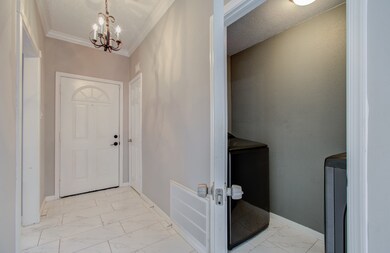 This is a bright, welcoming entryway with elegant
