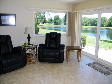 portion of living room with close up of lake view
