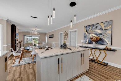 Kitchen with pendant lighting, light hardwood / wo