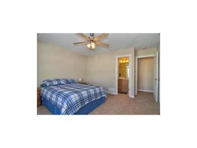 Large master bedroom with private bathroom.