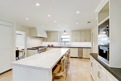 On the right wall is a Miele coffee maker and buil