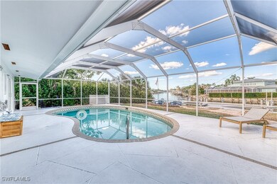 Pool featuring a patio area and glass enclosure