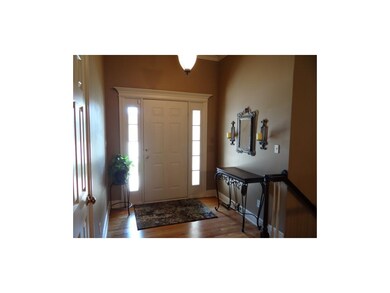 Front Entry Way With Coat Closet & Hardwood Floors