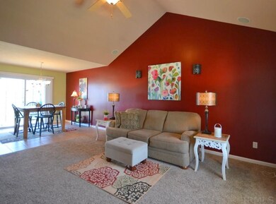 Open concept living room with cathedral ceilings.