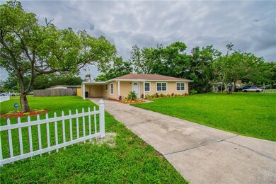 Front yard, large corner lot. Long driveway leadin