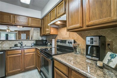 Kitchen includes: Granite counters, tile backsplas