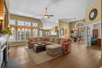 Living area featuring a textured ceiling, a firepl