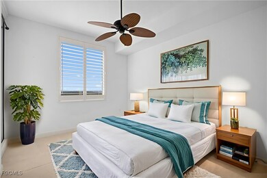 Carpeted bedroom with baseboards and a ceiling fan