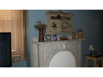 Living Room. Marble fireplace mantel adds elegance