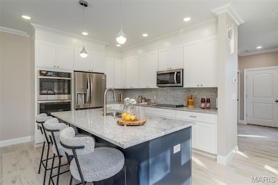 Bright and open Kitchen with Granite Tops custom cabinets and high end appliances