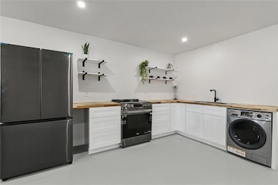 The thoughtfully curated kitchen pairs butcher blo