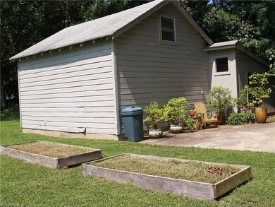 Rear view of workshop with more space for container gardening, herb gardening and entertainment.