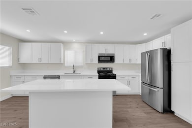Kitchen featuring appliances with stainless steel